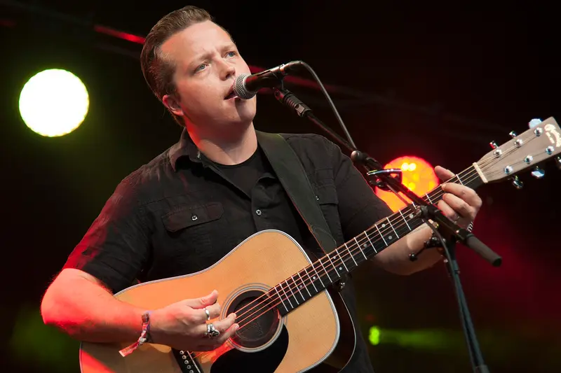 Jason Isbell performing with a guitar