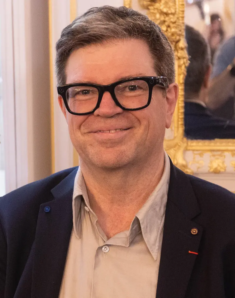 Demis Hassabis speaking at a public event